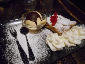 Oven-warmed apple strudel with vanilla ice cream